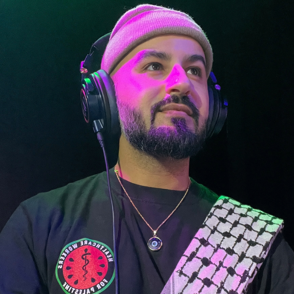 dark blue handmade turkish evil eye necklace modeled on DJ. lampwork glass evil eye framed in gold-plated stainless steal with gold-plated stainless steel chain.