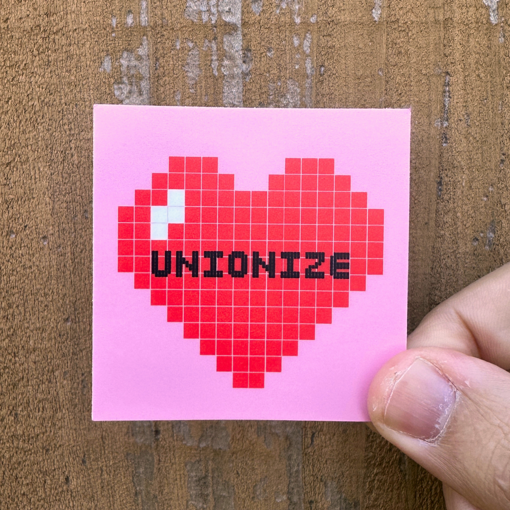 Pixelated heart with 'UNIONIZE' text on a pink background. socialist sticker