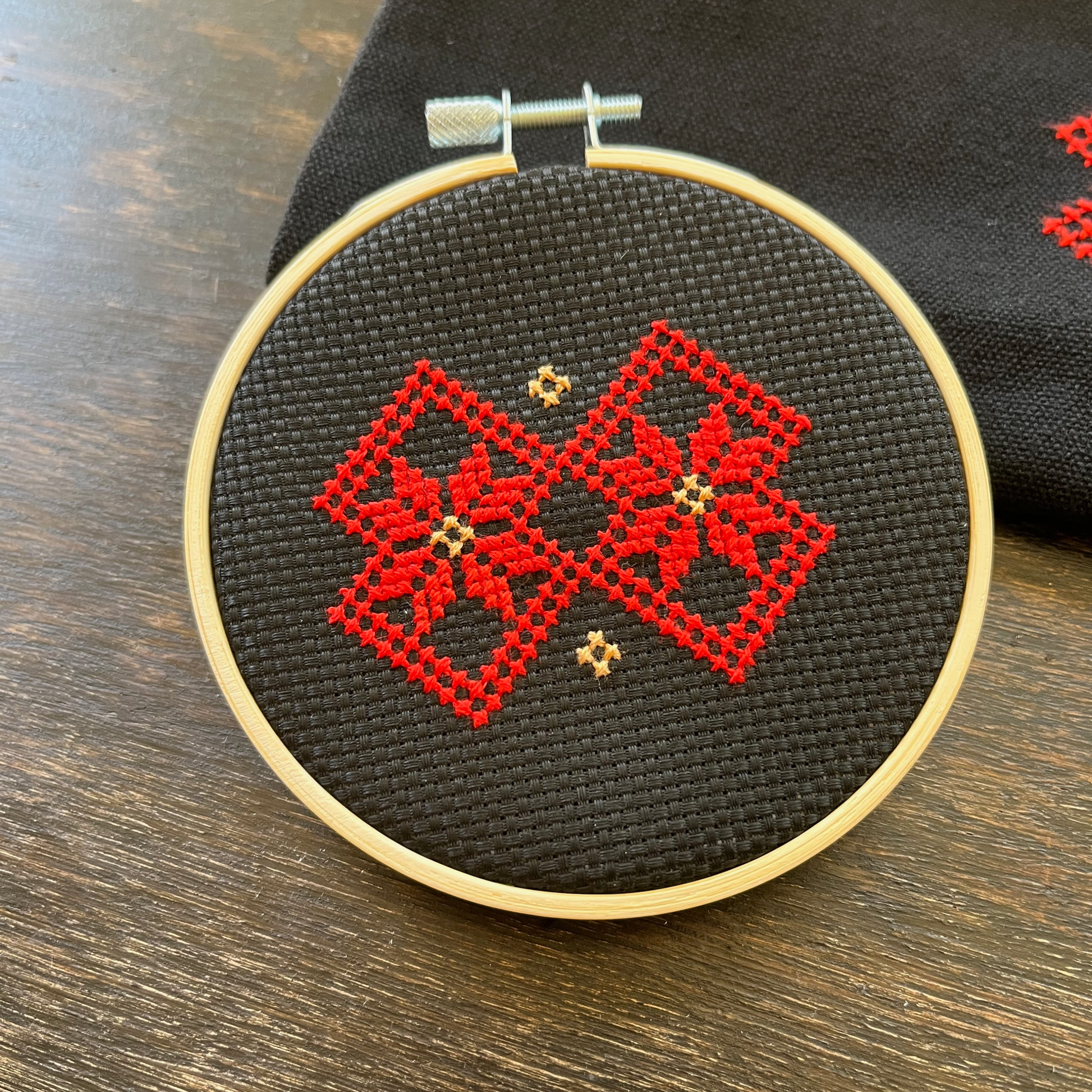 Tatreez hoop kit with black aid cloth, embroidery hoop, and Ramallah Star Moon design