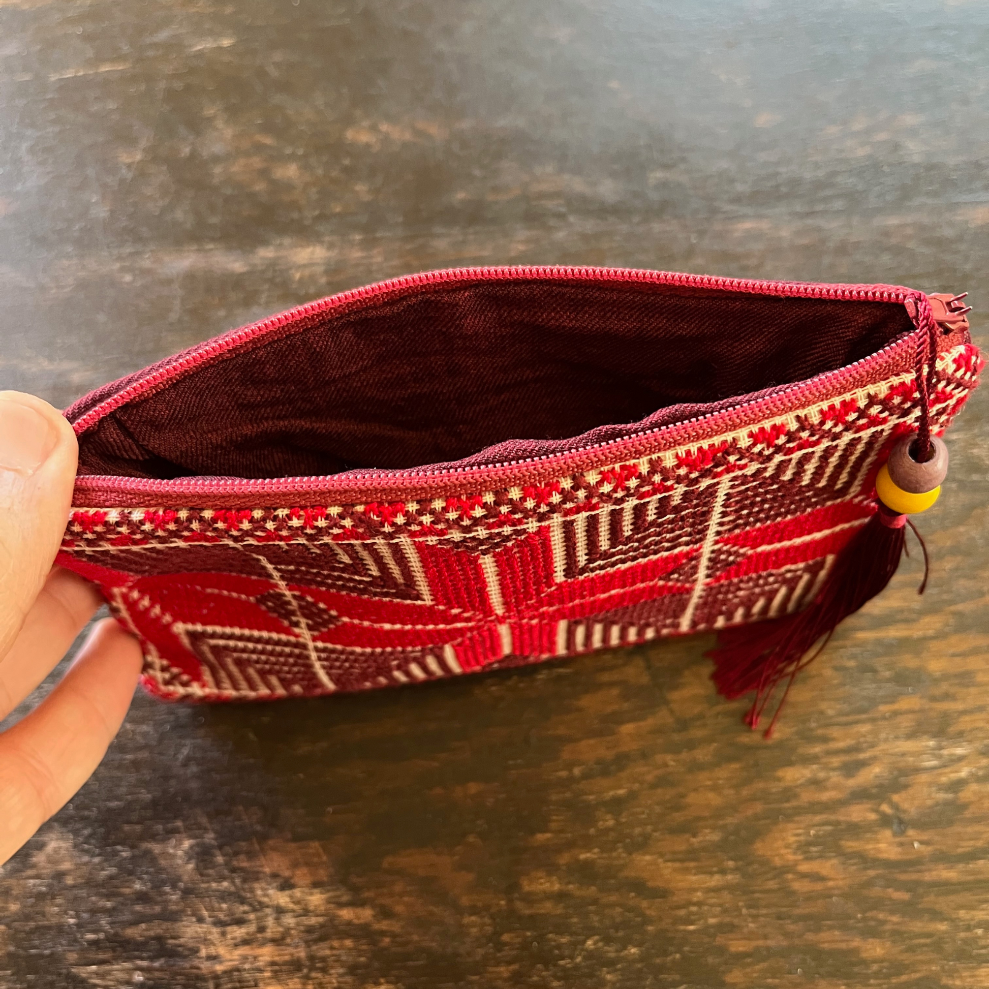 Palestinian tatreez embroidered purse/wallet/clutch bag. red and purple moon with feathers design. unzipped to see interior, view from above