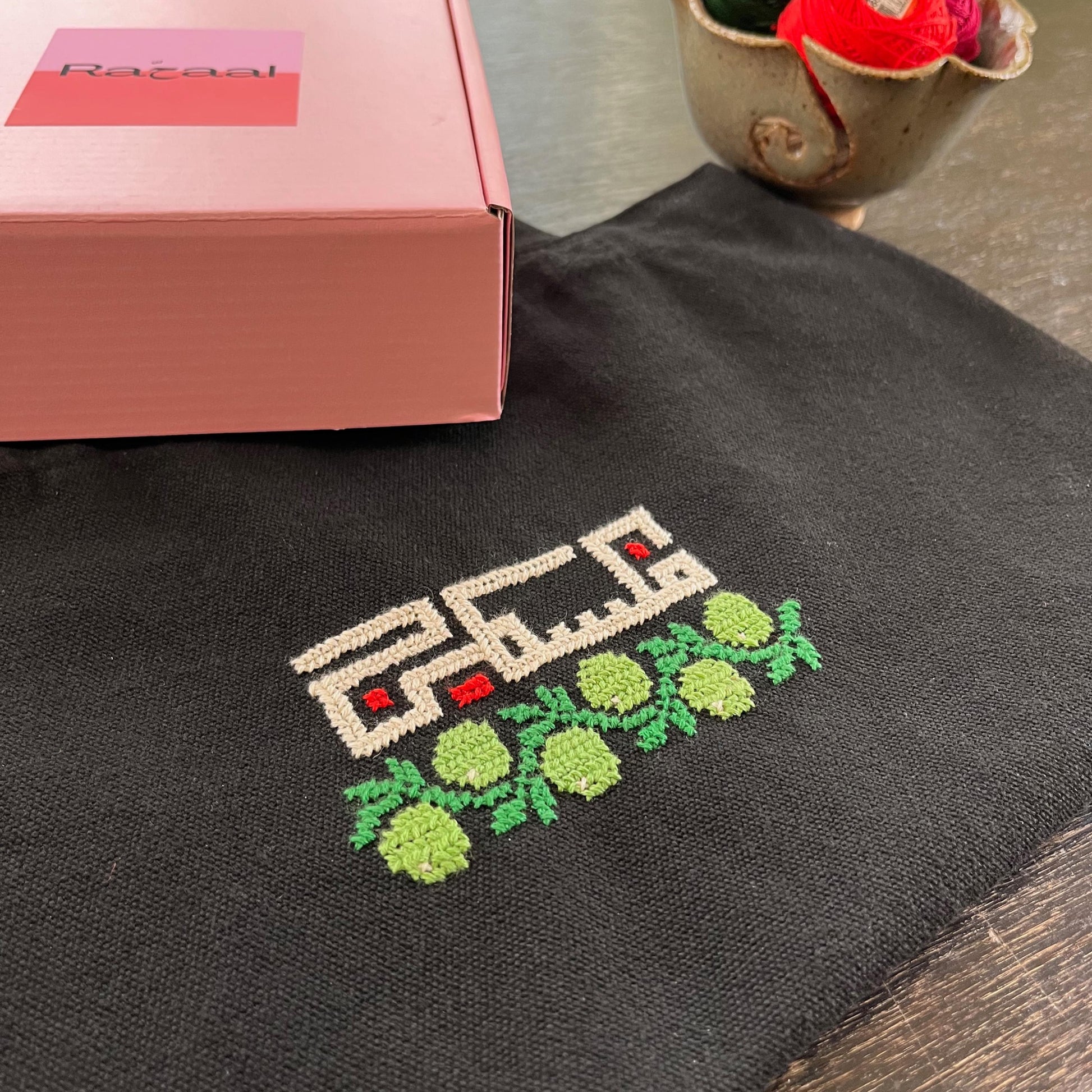 finished tatreez tote bag kit with olive and Palestine design, side view