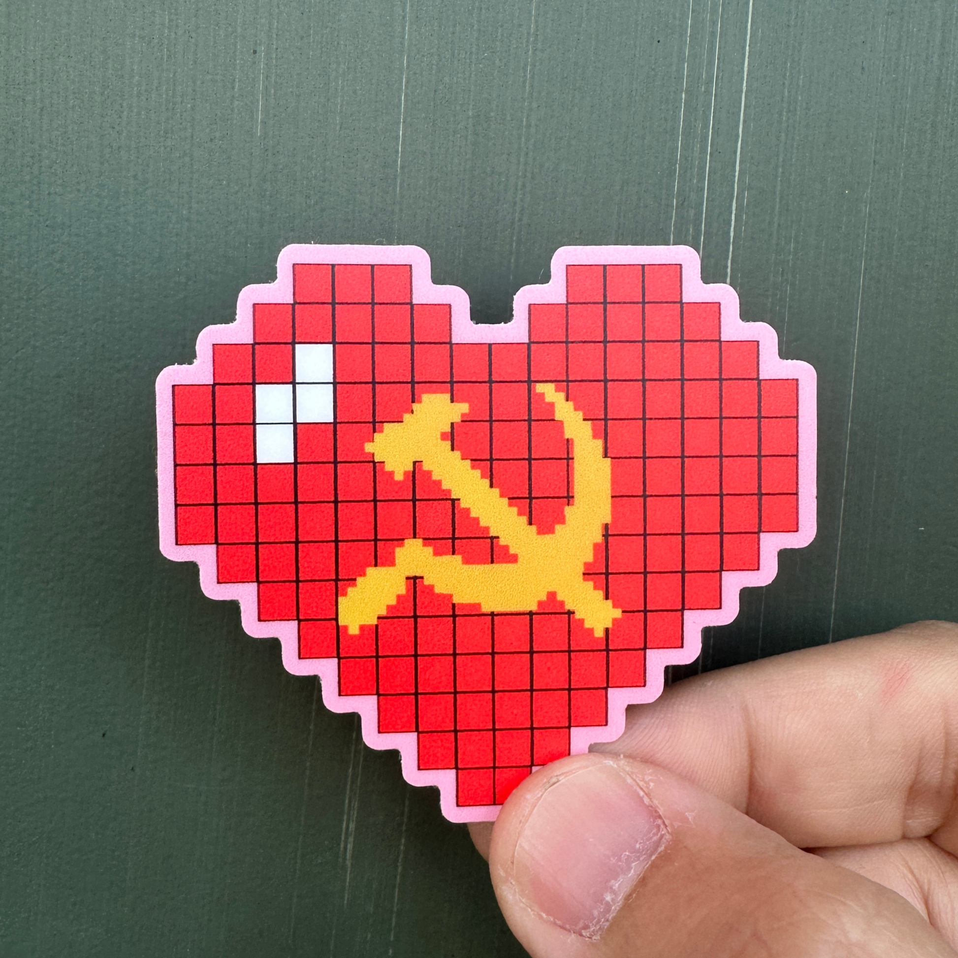 Pixelated heart-shaped sticker with a yellow hammer and sickle symbol on a pink background socialist sticker communist sticker ussr sticker